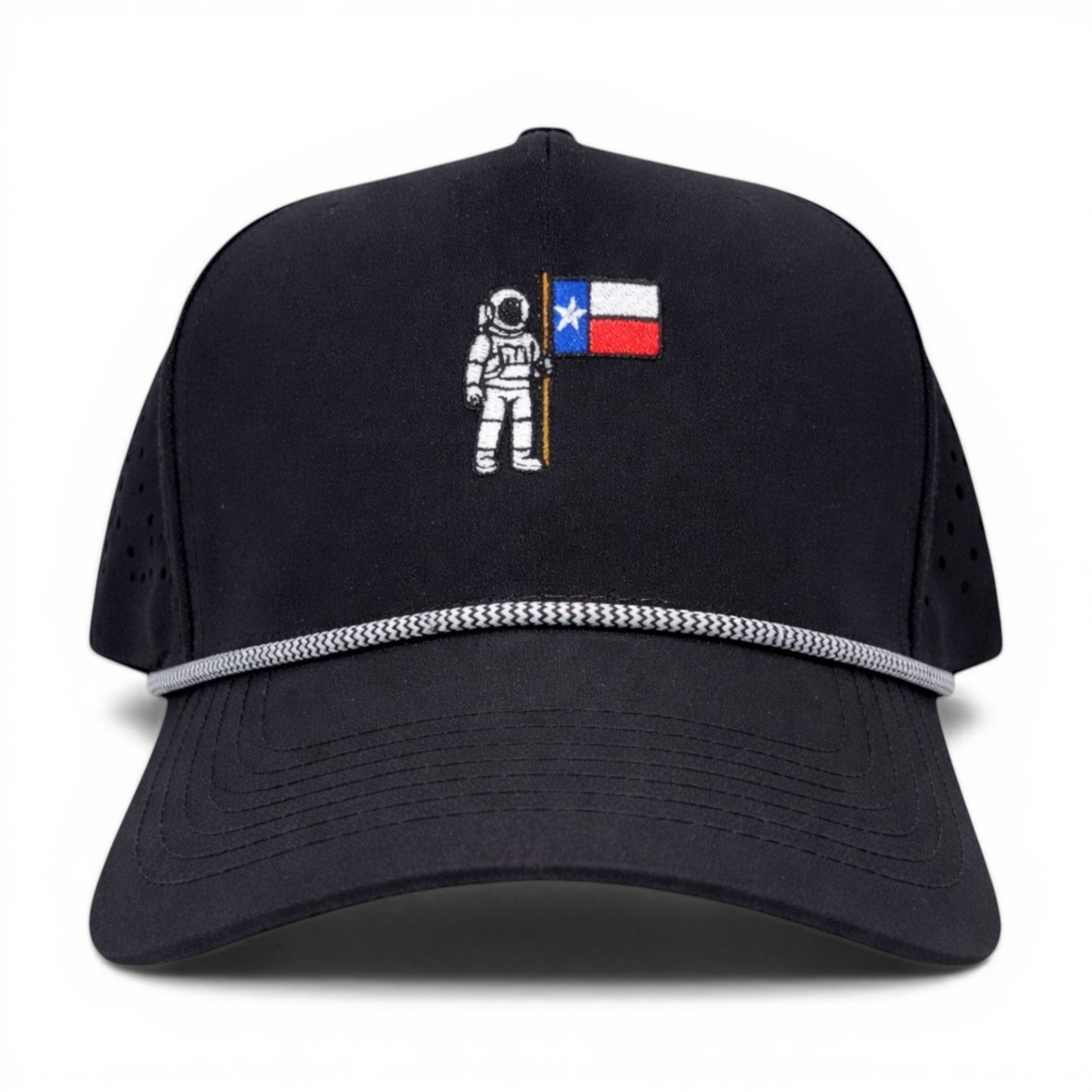 Mad Capper black rope hat with embroidered astronaut holding Texas flag. Features perforated sides and classic rope detail.