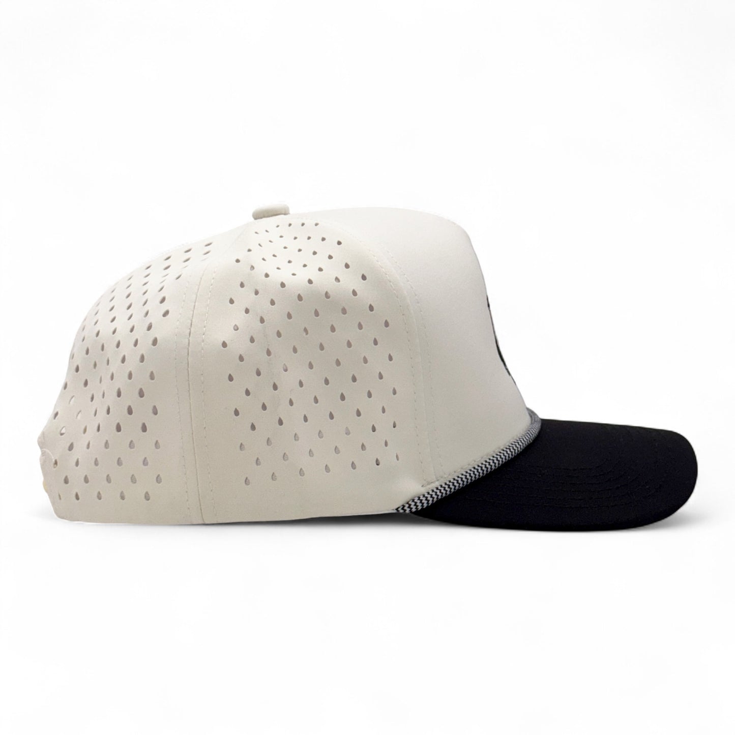 Two baseball caps, one beige with perforated design and one black, on a white background.