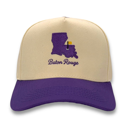 Beige and purple cap with Louisiana map and 'Baton Rouge' text on a white background