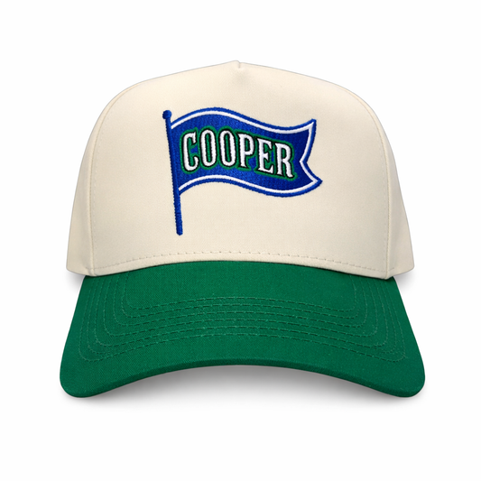 Beige and green cap with 'Cooper' logo on a white background