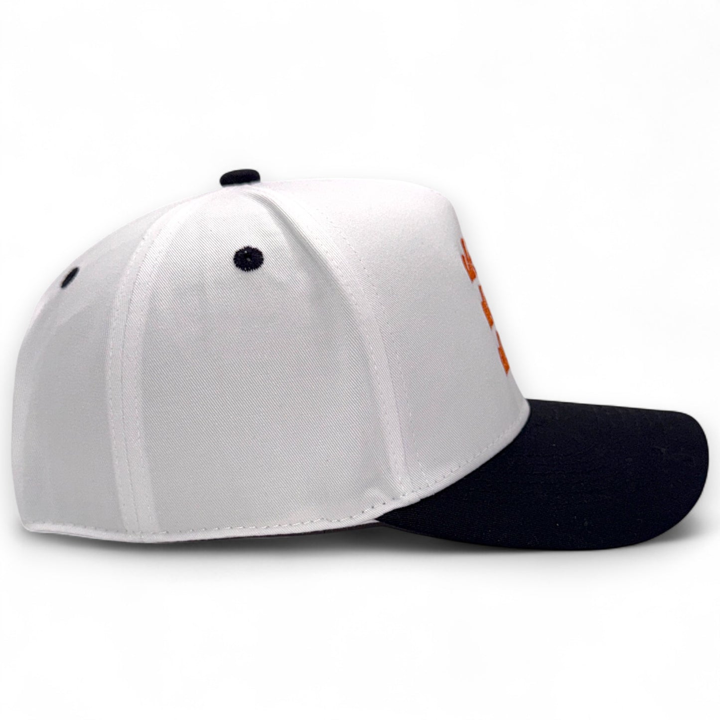 Side profile of white and black rope-trucker hat