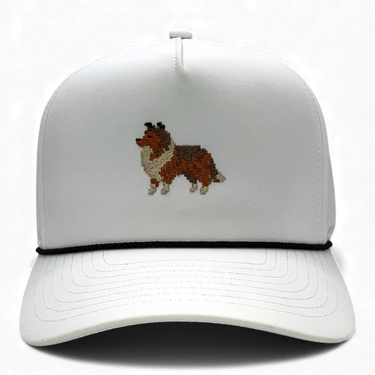 White performance rope hat with embroidered pixel Sheltie on front panel.