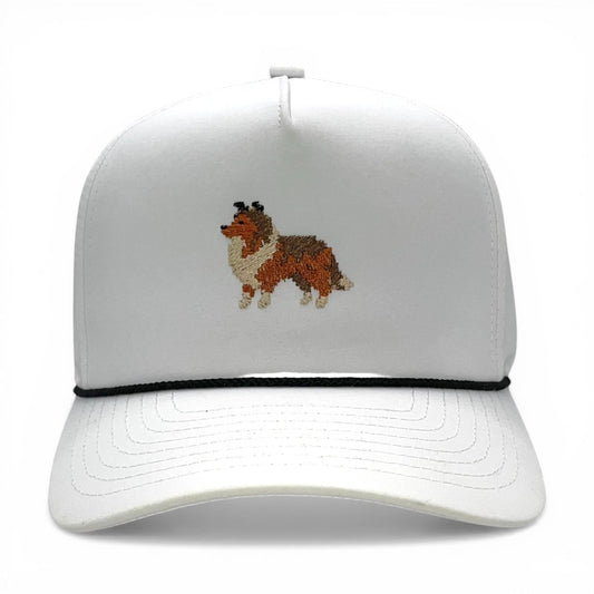 White performance rope hat with embroidered pixel Sheltie on front panel.