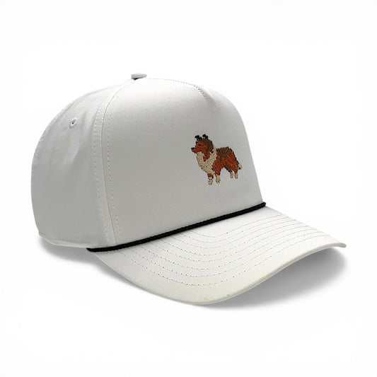Left side angled view of white rope hat featuring pixel-style Sheltie embroidery
