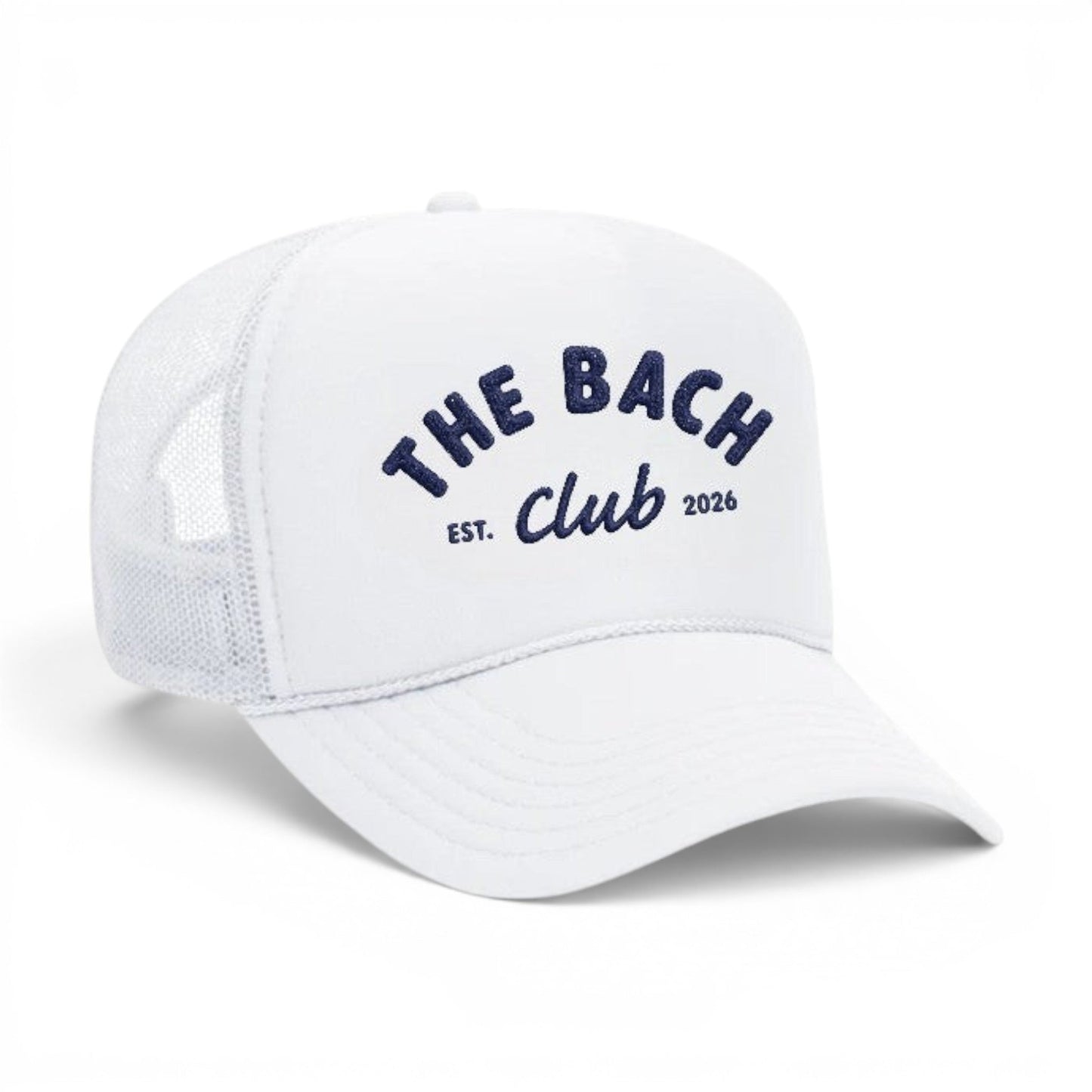 Mad Capper white trucker hat with navy blue embroidery reading "The Bach Club EST. 2026". Mesh back for breathability.