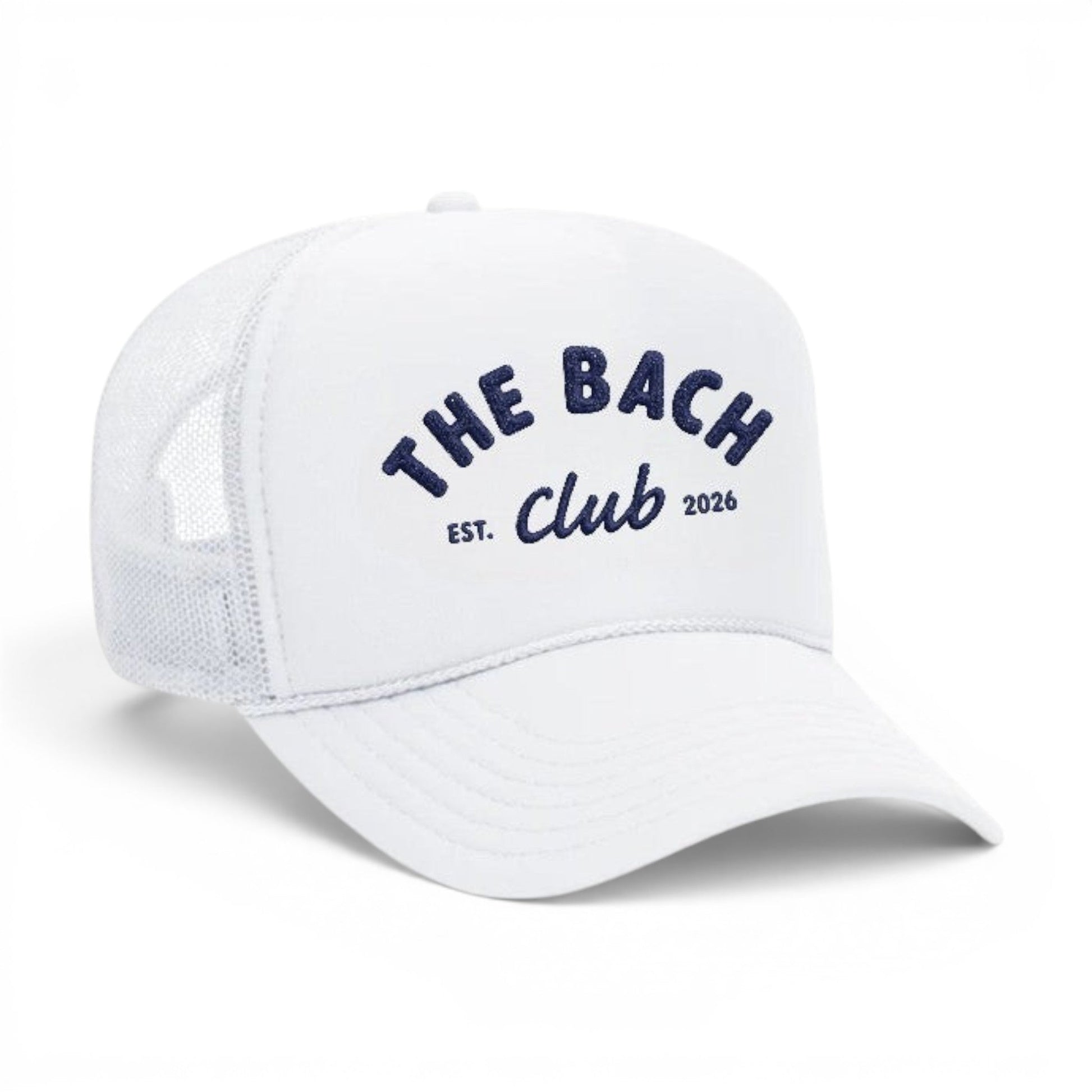 Mad Capper white trucker hat with navy blue embroidery reading "The Bach Club EST. 2026". Mesh back for breathability.