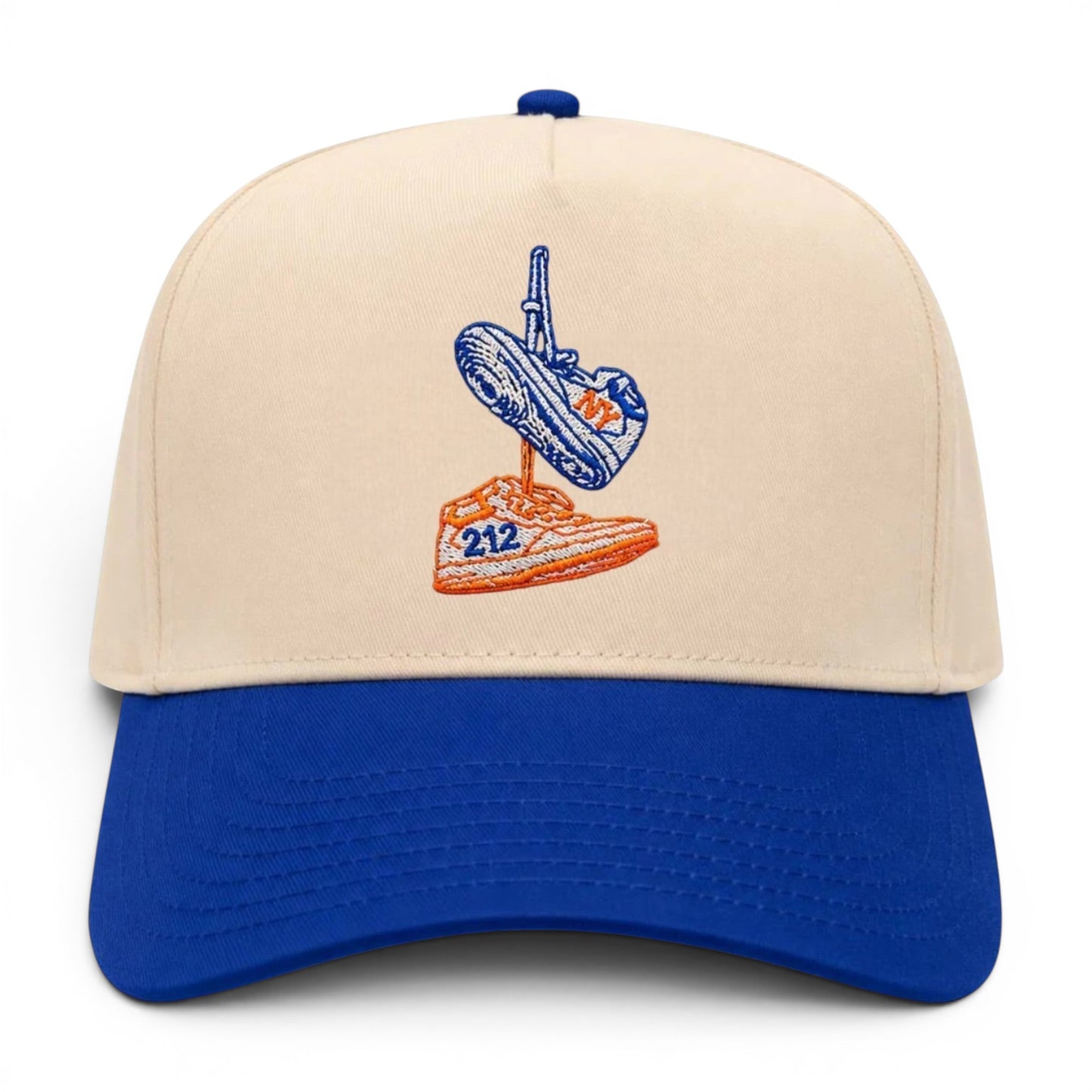 Mad Capper New York Kicks embroidered snapback hat. Features a cream crown and blue brim with embroidered sneakers.