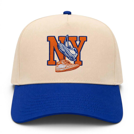 Mad Capper New York Kicks hat with embroidered NY and sneakers on a cream crown and blue brim.
