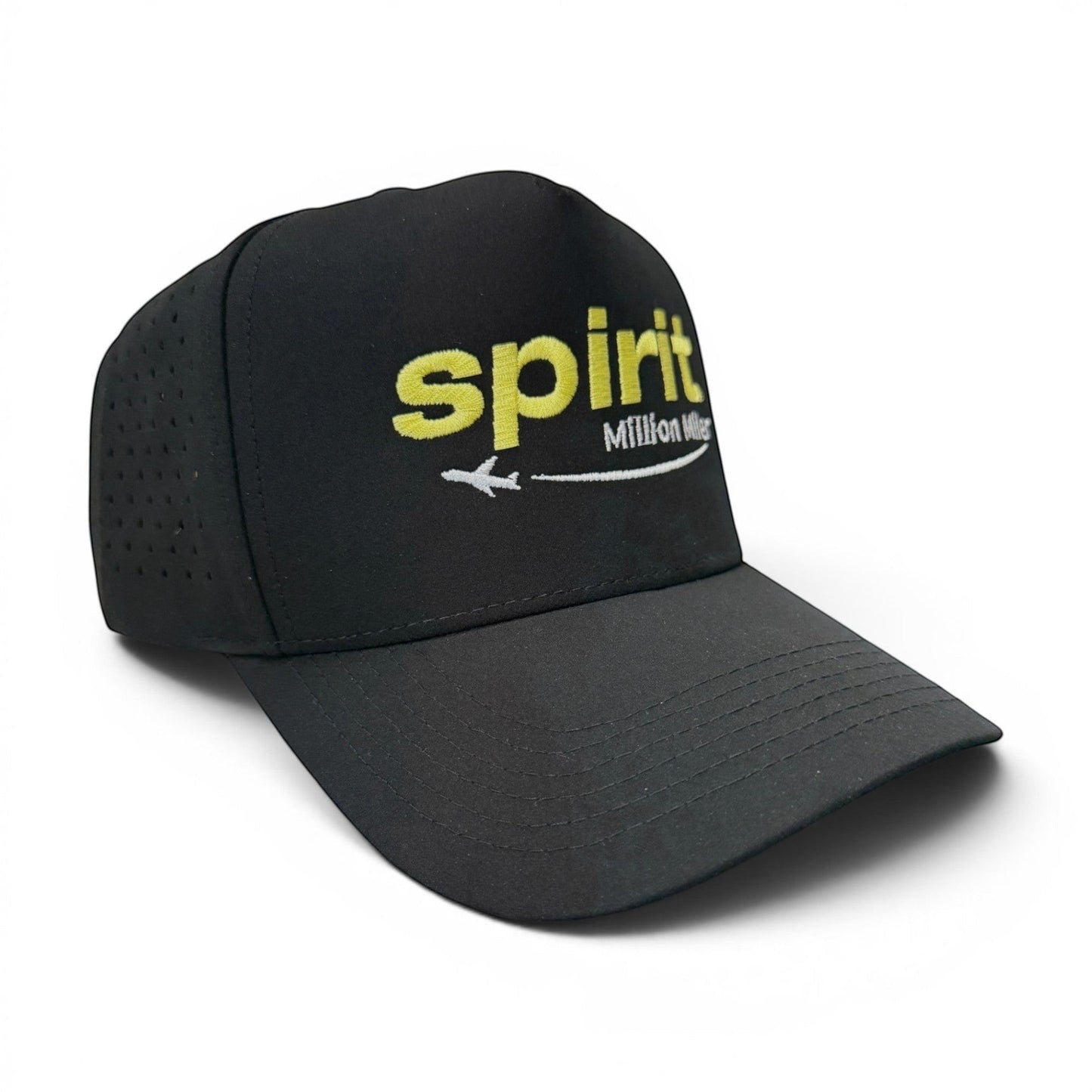 Mad Capper black baseball cap with yellow "spirit" logo, white airplane, and "Million Miler" text. Curved brim, perforated sides.