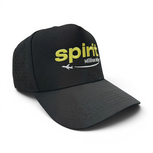 Mad Capper black baseball cap with yellow "spirit" logo, white airplane, and "Million Miler" text. Curved brim, perforated sides.