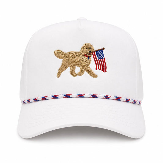 Mad Capper white snapback hat with embroidered golden doodle carrying American flag and red, white & blue rope detail.