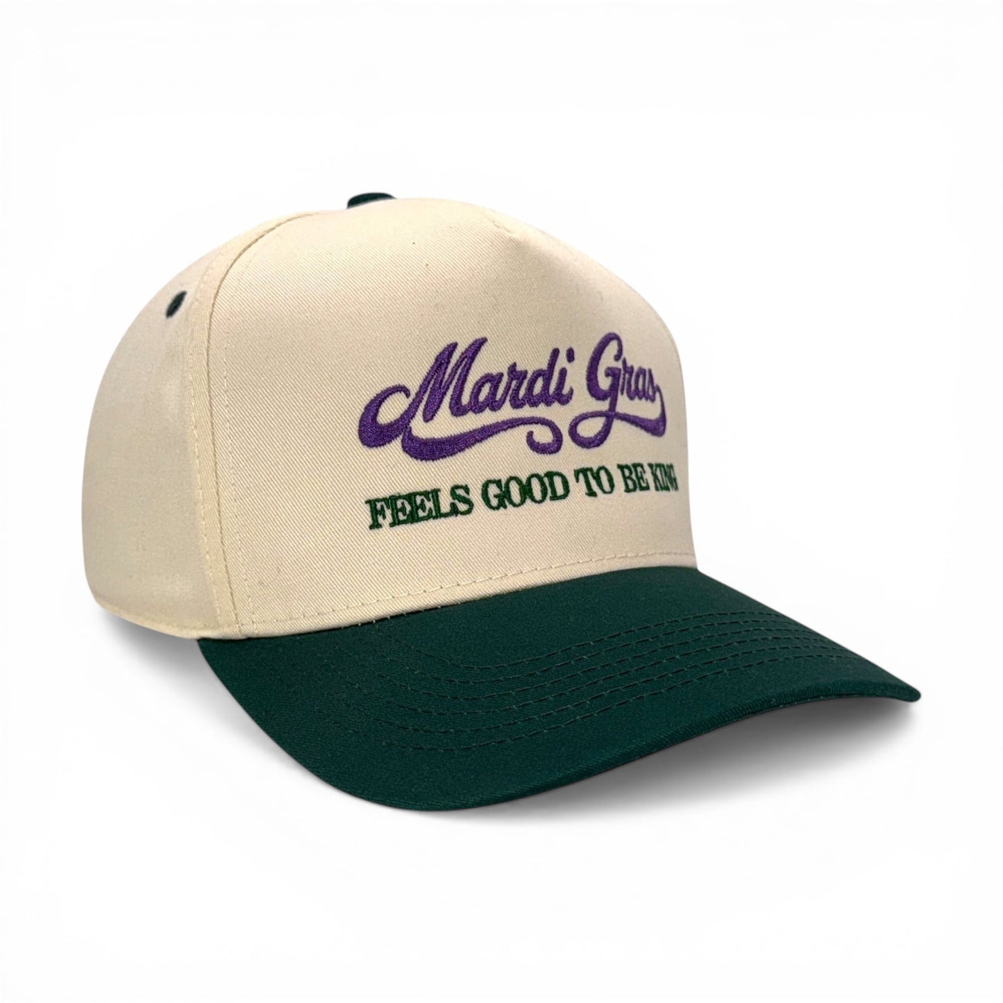 Mad Capper Mardi Gras King Hat in cream and dark green with embroidered text. Adjustable fit.
