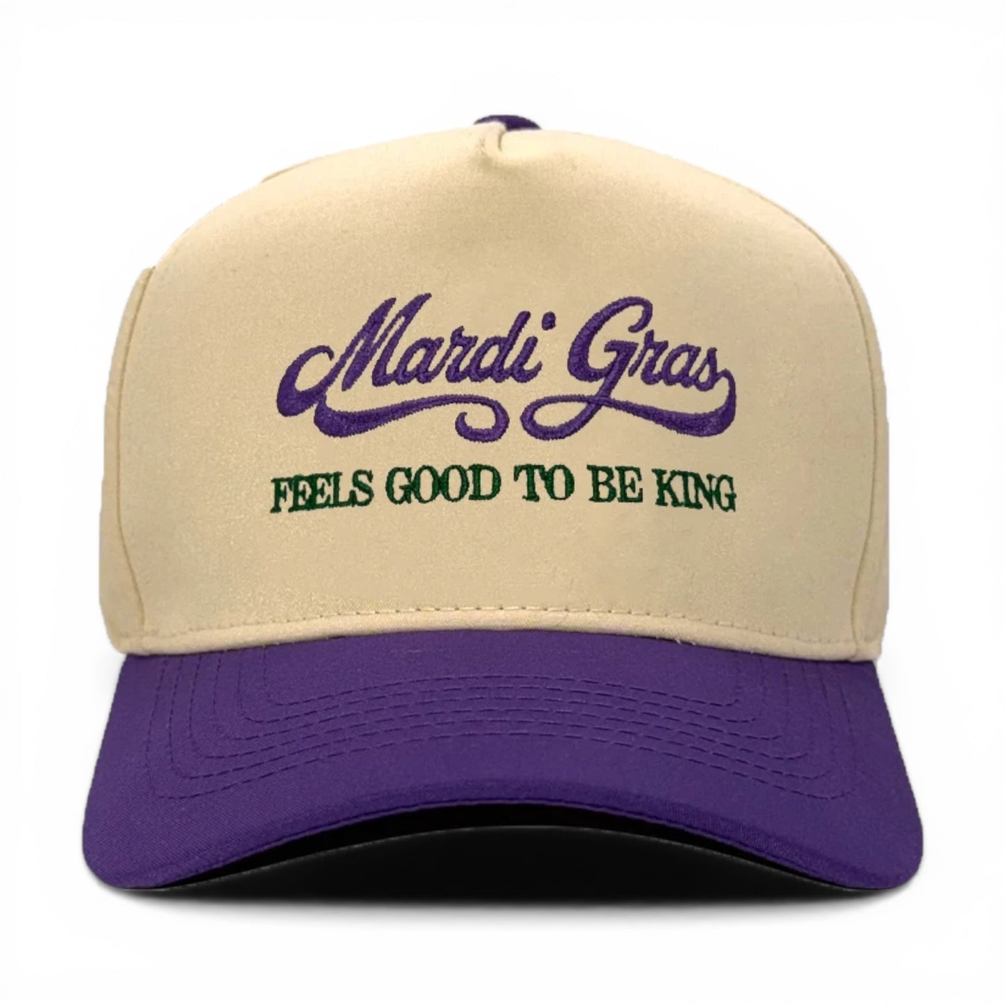 Mad Capper Mardi Gras King Hat in cream with purple brim and embroidery. Features adjustable fit.
