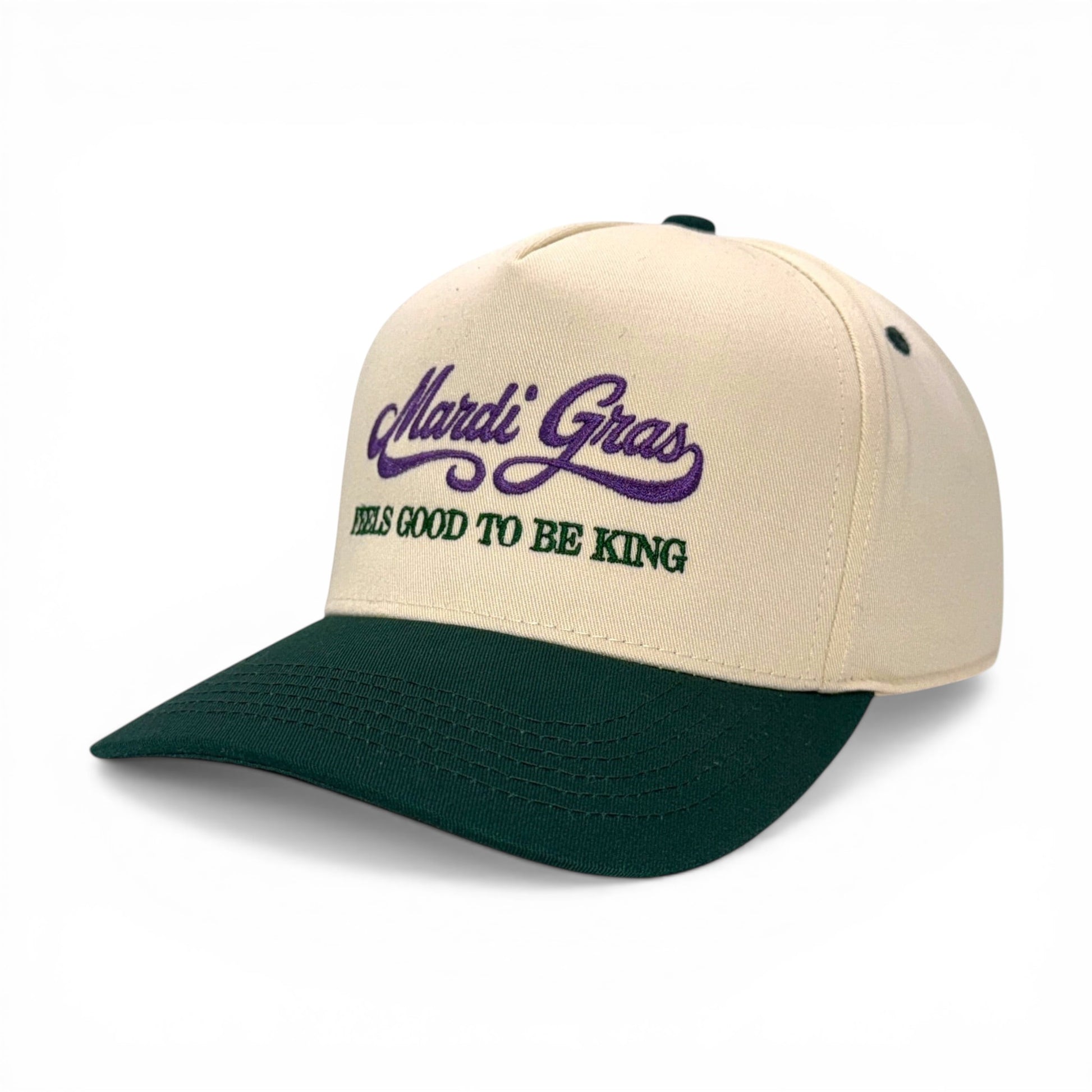 Mad Capper Mardi Gras King Hat in cream with purple embroidery and green brim. Adjustable fit.