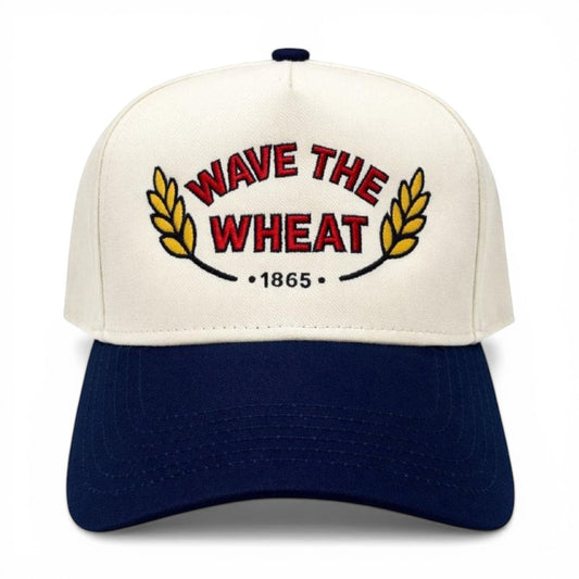 Mad Capper cream and navy blue trucker hat with embroidered 'Wave the Wheat' design and adjustable snapback.